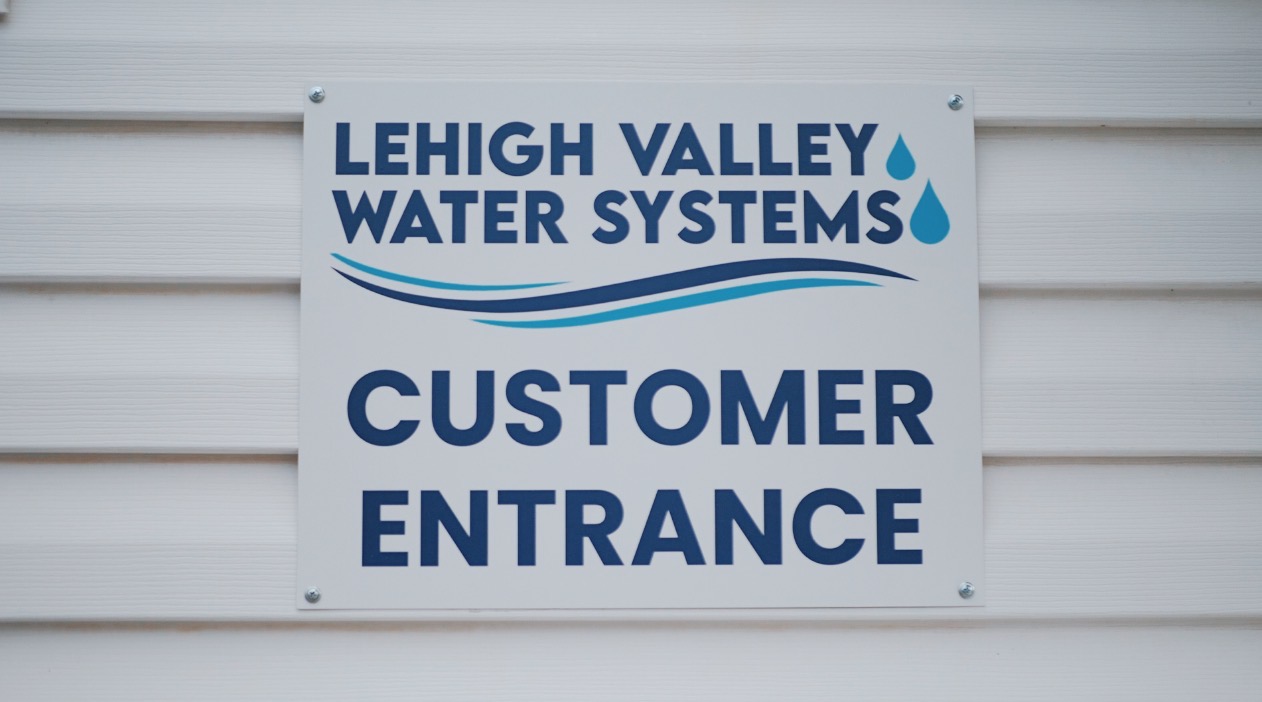 Lehigh Valley Water Systems sign saying " Customer Entrance "